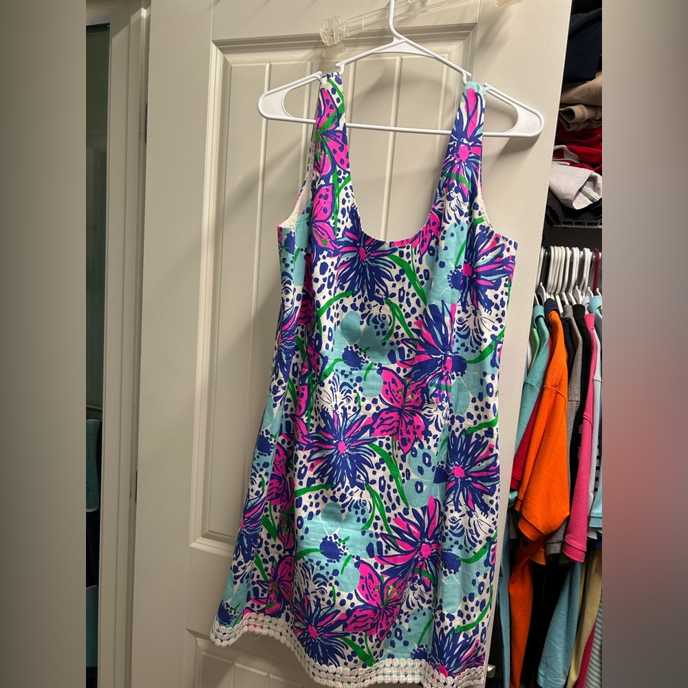Lilly Pulitzer Shift dress. Zips down the back. Detail around the bottom.